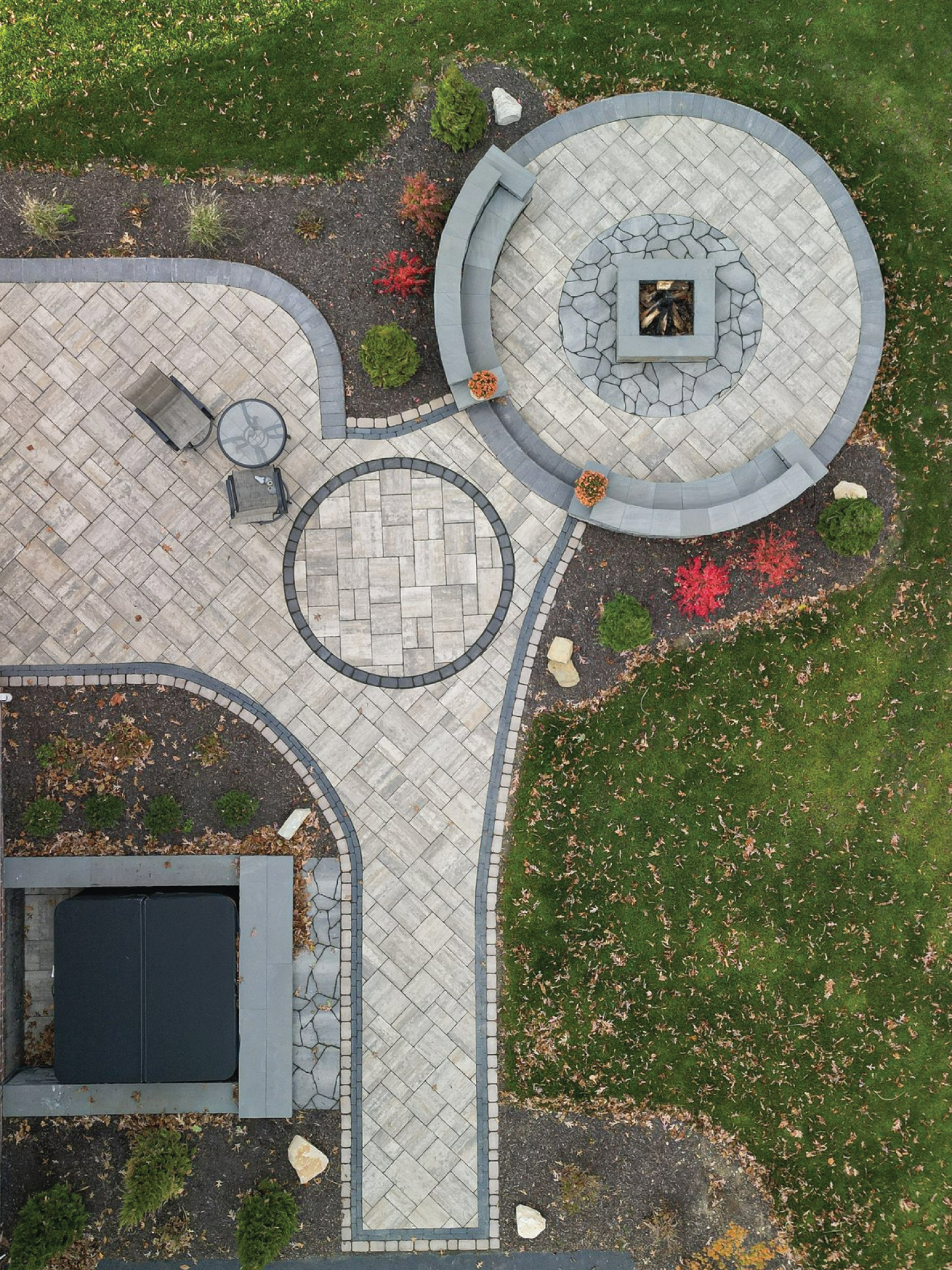 Finished paver patio and landscape installation by Elevated Landscaping